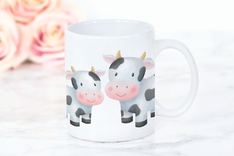 May include: White ceramic mug with a black and white cartoon illustration of two cows. The cows have black spots and pink noses.