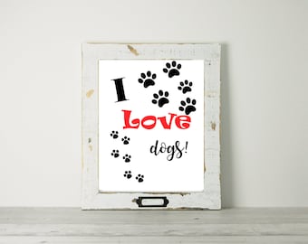 May include: A framed print with the words "I Love dogs!" in black and red, along with black paw prints. The frame is white with a distressed finish, and a small metal label holder is at the bottom.