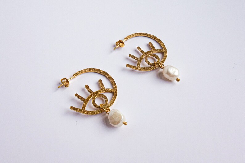 graphic Paloma evil eye style modern 24k gold plated earrings with freshwater pearl drops