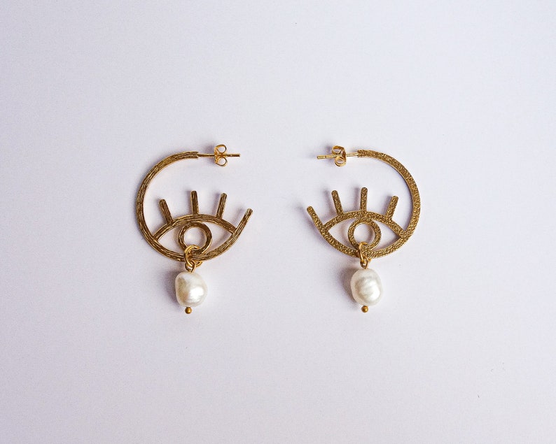 graphic Paloma evil eye style modern 24k gold plated earrings with freshwater pearl drops