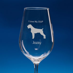 May include: A clear wine glass with an etched design of a German Wirehaired Pointer dog and the text "I Love My GWP Jazzy".