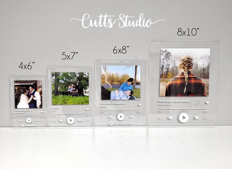 May include: Four acrylic photo frames in different sizes, 4x6 inches, 5x7 inches, 6x8 inches, and 8x10 inches. Each frame has a white border and a white play button. The frames are displayed on a grey wall. The frames are designed to look like a music player screen.
