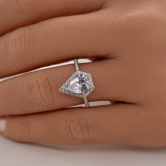 Triangle Blue Topaz Ring Sterling Silver Cubic Zirconia Halo and Side Stones Triangle Blue Topaz Ring Sterling Silver Cubic Zirconia Halo and Side Stones