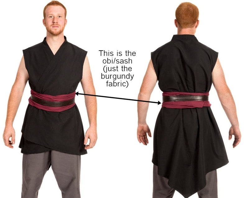 May include: A black sleeveless tunic with a burgundy obi/sash tied around the waist. The sash is made of a soft, flowing fabric.