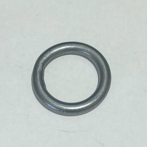 May include: A silver metal ring, also known as a key ring, is a simple and functional accessory.