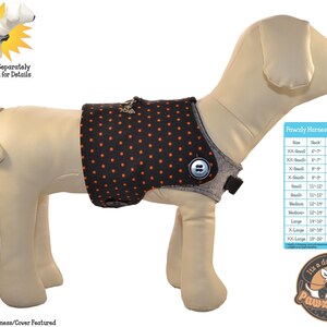 May include: A black dog vest with orange polka dots and a gray trim. The vest has a button closure and a leash attachment. The vest is being worn by a dog mannequin. A size chart is included in the image. The chart shows the size, neck, chest, and weight measurements for different dog sizes. The text "Pawzly Harness Fitting Chart" is at the top of the chart. The text "It's a doggy thing Pawzly.com" is at the bottom of the chart.