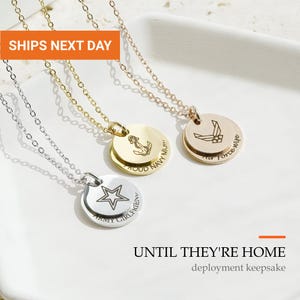 May include: Three metal necklaces with circular pendants. One silver pendant features a star and the text ARMY GIRLFRIEND. One gold pendant shows an anchor and the text PROUD NAVY MUM. One rose gold pendant displays an Air Force emblem and the text Air Force wife.
