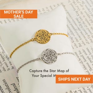 May include: Two bracelets, one gold-toned and one silver-toned, each featuring a circular pendant with a star map design. The bracelets are displayed on a white surface with text in the background. The image includes the text "MOTHER'S DAY SALE".