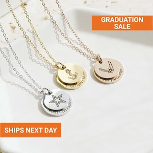 May include: Three pendant necklaces with different designs. One is silver with a star, one is gold with an anchor, and the other is gold with an airplane. The text "ARMY GIRLFRIEND", "PROUD NAVY MUM", and "Air Force Wife" are engraved on the pendants. The text "GRADUATION SALE" and "SHIPS NEXT DAY" are also visible.