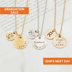 May include: Gold, silver, and rose gold necklaces with personalized round pendants. The pendants feature engraved names, initials, graduation years, and a graduation cap design. The necklaces are displayed on a white background.