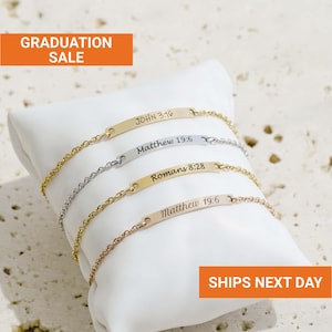 May include: Four delicate bracelets with chain links and rectangular nameplates, each engraved with a Bible verse. The bracelets are gold, silver, and rose gold. The text "GRADUATION SALE" and "SHIPS NEXT DAY" are also visible.