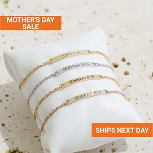 May include: Four delicate bracelets with chain links and rectangular nameplates, each inscribed with a Bible verse. The bracelets are gold, silver, and rose gold. The text "MOTHER'S DAY SALE" is in an orange rectangle. The text "SHIPS NEXT DAY" is in an orange rectangle.