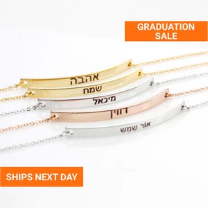 May include: A collection of curved bar necklaces in gold, silver, and rose gold. Each necklace features engraved text. The image includes the text "GRADUATION SALE" and "SHIPS NEXT DAY".