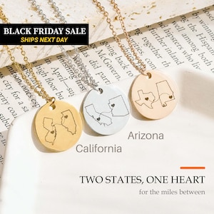 May include: Three circular pendant necklaces in gold and silver tones, each featuring two engraved state outlines connected by a dashed line with a small heart. The text reads BLACK FRIDAY SALE, SHIPS NEXT DAY, California, Arizona, and TWO STATES, ONE HEART.