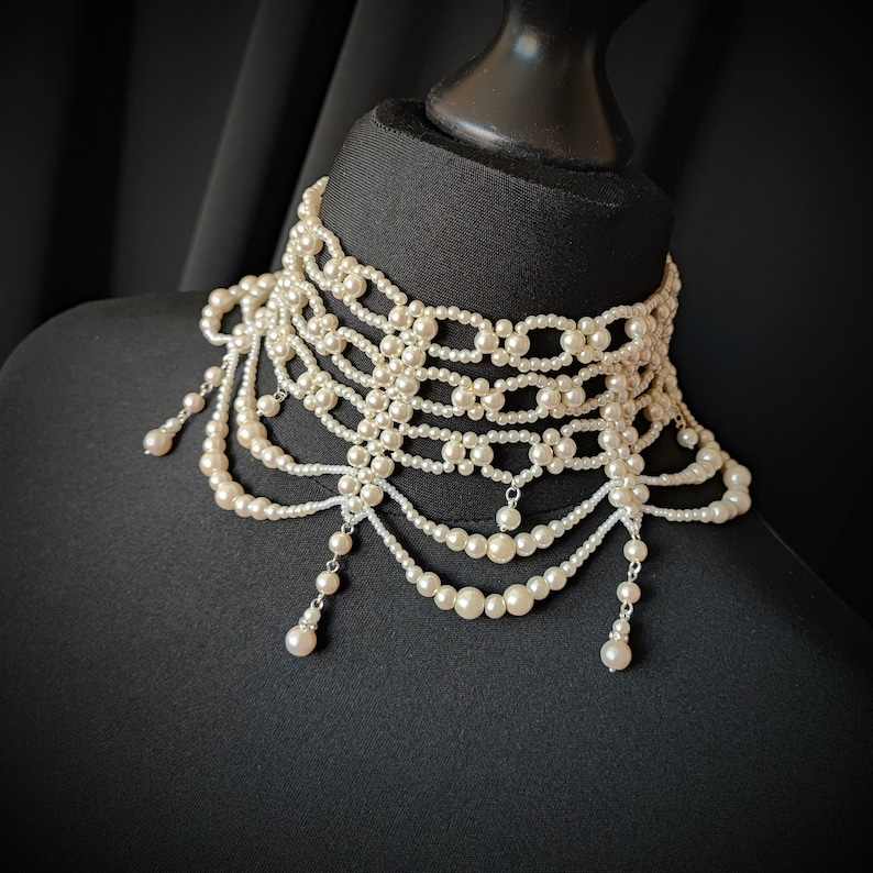 May include: A set of three ceramic mugs with a speckled, matte finish. The mugs are in shades of cream, light gray, and dark gray. Each mug has a simple, modern design and a rounded handle.