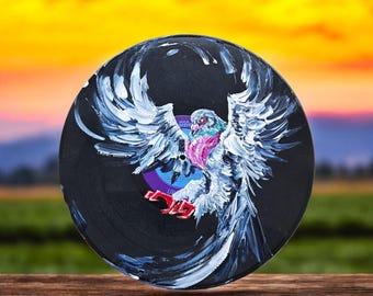 Pigeon painting on a vinyl record