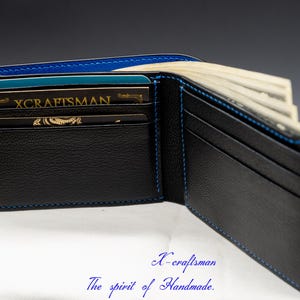 May include: A black leather wallet with blue stitching, open to reveal multiple card slots and a cash compartment. The wallet has a gold embossed logo that reads "X-craftsman".