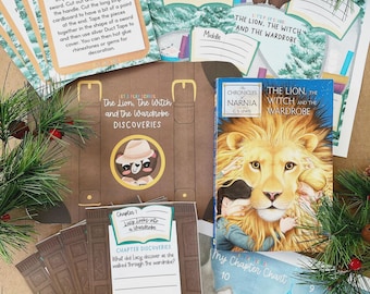 May include: A collection of educational activity sheets and a book titled The Lion, the Witch and the Wardrobe. The materials include an Explorer Challenge card, a discovery folder, and a chapter chart featuring illustrations of a lion.