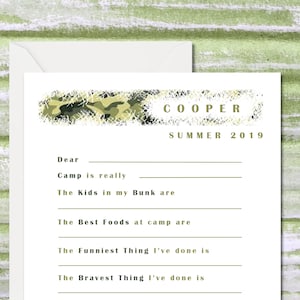 May include: A white fill-in-the-blank camp stationery set with a camouflage design and the name "COOPER" above the text "SUMMER 2019". The stationery includes prompts for writing about camp experiences.