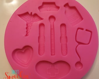 May include: A bright pink silicone mold with various medical-themed shapes. The mold includes a caduceus, a nurse's cap, a bottle, a stethoscope, a heart, and medical tools. The text "Sweet Smackin' Treats" is visible.