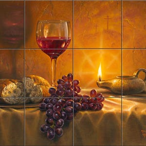 May include: A mural composed of twelve square tiles depicting a still life painting. The scene features a glass of red wine, a cluster of purple grapes, a loaf of bread, and an oil lamp with a lit flame against a warm, golden background.