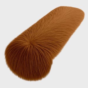 May include: A long, brown, cylindrical pillow covered in soft, fluffy fur.