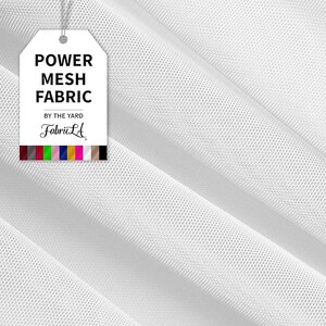 May include: White power mesh fabric with a fine, open weave. A tag reads "POWER MESH FABRIC" and "FabricLA" with a color palette. The fabric is draped, showing the texture and drape.