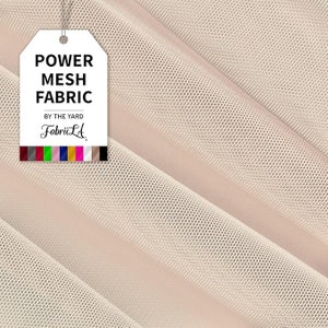 May include: Beige power mesh fabric, displayed in diagonal folds. A white tag reads "POWER MESH FABRIC" and "BY THE YARD FabricLA" with a color swatch. The fabric has a fine, open weave, suitable for various apparel and craft projects.