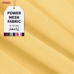 May include: Close-up of yellow power mesh fabric. A tag reads "POWER MESH FABRIC" with the Fabric LA logo. The fabric is a light, airy material, ideal for apparel and craft projects.