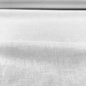 May include: Close-up of a white fabric with a subtle texture. The fabric is smooth and has a slight sheen.