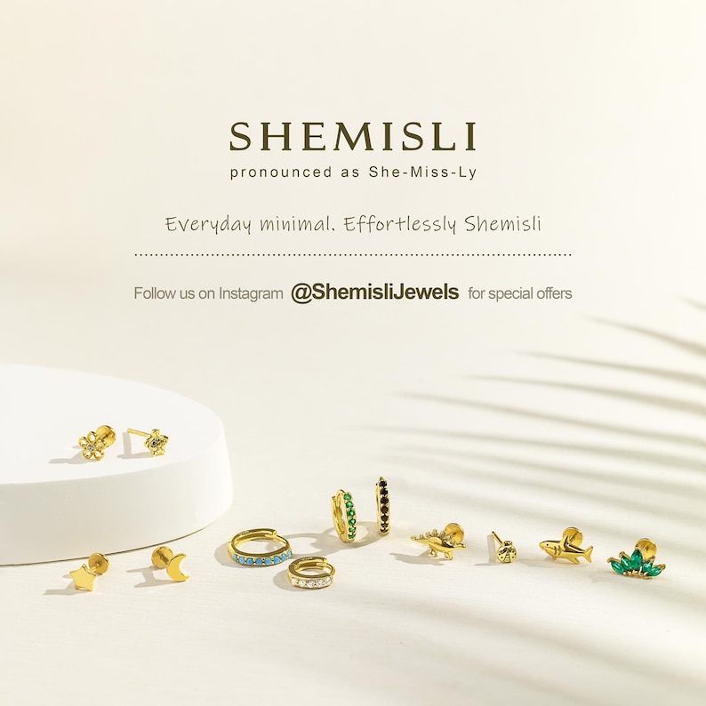 a group of different types of rings on a white surface