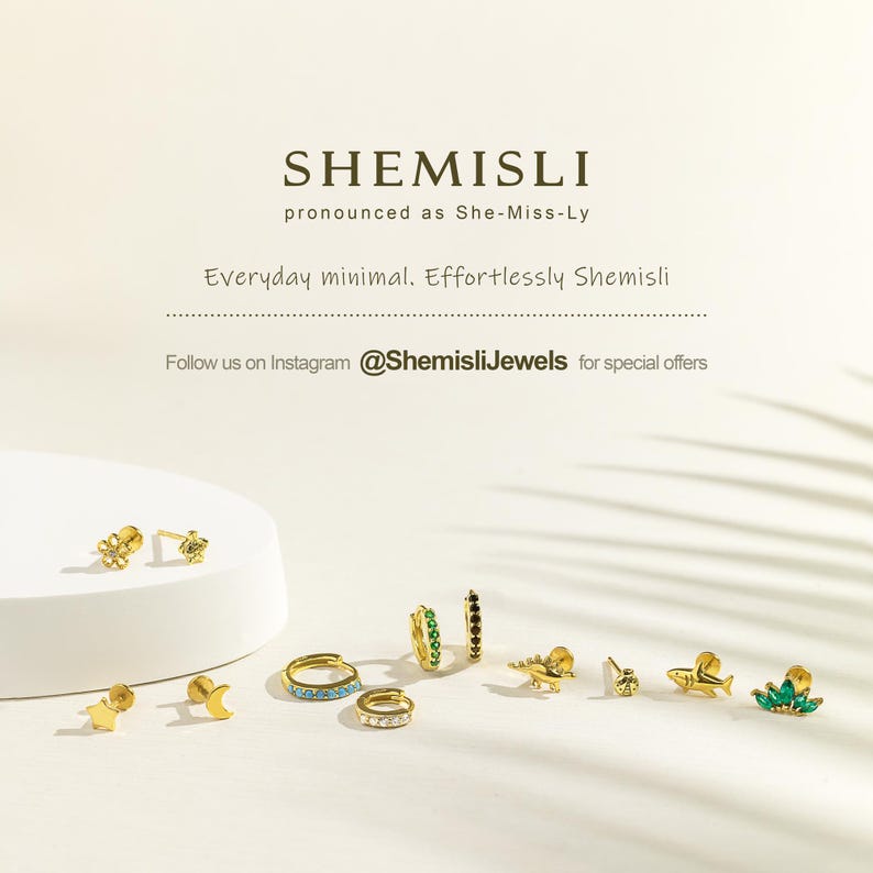 a group of different types of rings on a white surface