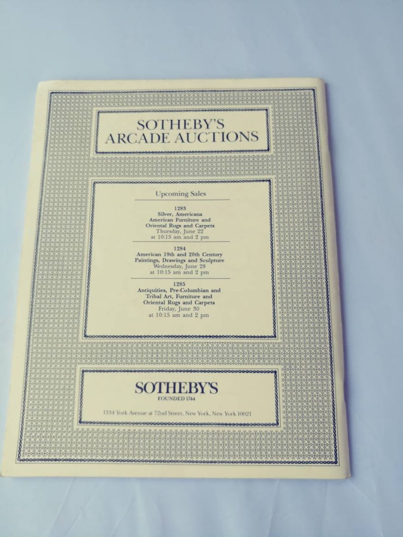 May include: A black and white image of a Sotheby's Arcade Auctions flyer announcing upcoming sales of silver, Americana, American furniture, Oriental rugs and carpets, American 19th and 20th century paintings, drawings and sculpture, and antiquities, Pre-Columbian and Tribal Art, furniture and Oriental rugs and carpets. The flyer lists the dates and times of the sales. The Sotheby's logo is at the bottom of the flyer.