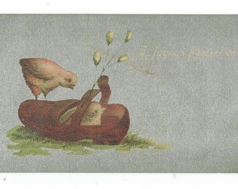 Antieke ansichtkaart Pasen A Joyous Eastertide Chick in The Shoe grappige vintage efemere verschijnselen verdeeld op de achterkant