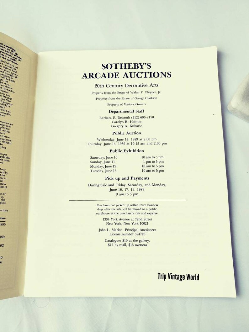 May include: A black and white printed page with the text "Sotheby's Arcade Auctions" and information about a public auction of 20th century decorative arts. The auction will take place on June 14 and 15, 1989, at 1334 York Avenue in New York City.
