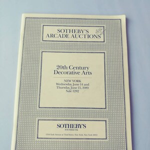 May include: A Sotheby's Arcade Auctions catalog for a 20th Century Decorative Arts sale in New York City on June 14 and 15, 1989. The catalog cover is white with black text and a black border.