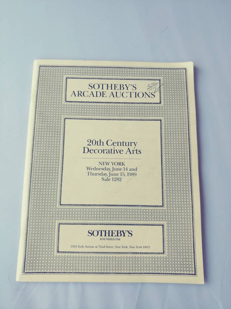 May include: A Sotheby's Arcade Auctions catalog for a 20th Century Decorative Arts sale in New York City on June 14 and 15, 1989. The catalog cover is white with black text and a black border.