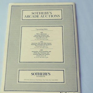 May include: A black and white image of a Sotheby's Arcade Auctions flyer. The flyer lists upcoming sales for silver, Americana, American furniture, oriental rugs and carpets, American 19th and 20th century paintings, drawings and sculpture, and antiquities, pre-Columbian and tribal art, furniture and oriental rugs and carpets. The flyer also includes the Sotheby's logo and address.