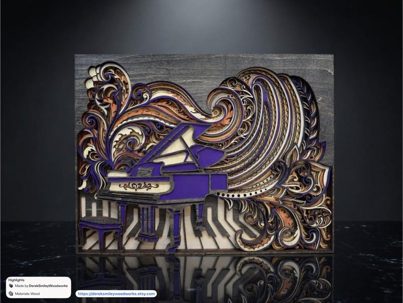 May include: A layered wooden art piece featuring a purple grand piano with a matching stool. The artwork has intricate swirling patterns in shades of purple, orange, and cream, set against a gray background. The piece is made of wood.