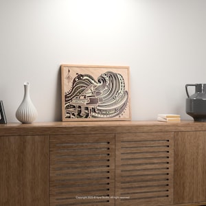 May include: A wooden framed artwork depicting a grand piano with a wave-like design in shades of brown, gray, and white. The artwork is displayed on a wooden cabinet, alongside decorative vases and books. The overall aesthetic is modern and artistic.