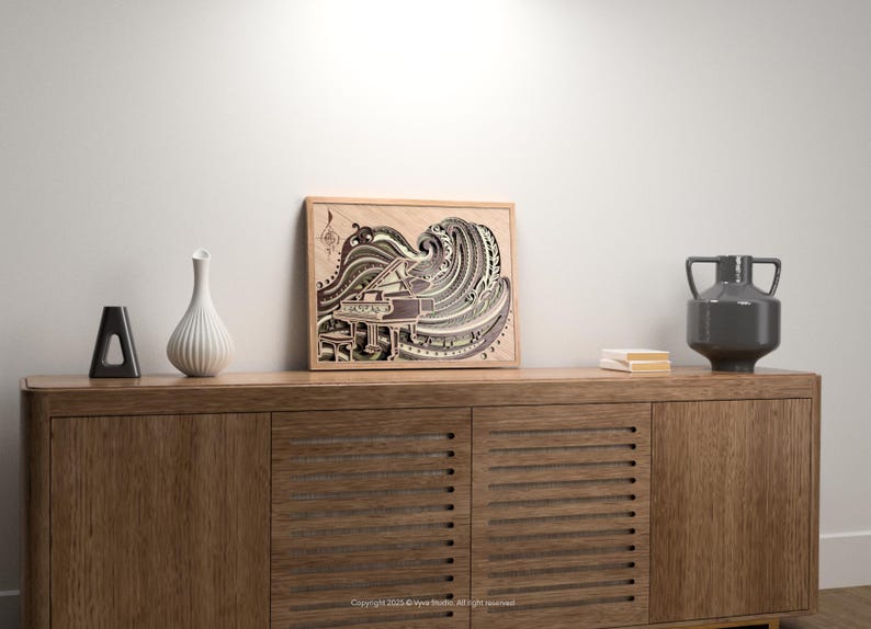 May include: A wooden framed artwork depicting a grand piano with a wave-like design in shades of brown, gray, and white. The artwork is displayed on a wooden cabinet, alongside decorative vases and books. The overall aesthetic is modern and artistic.