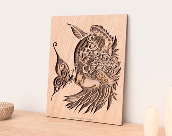 May include: A layered wooden art piece featuring a profile of a bird with intricate cut-out details. A butterfly is positioned near the bird's beak. The artwork is in shades of brown and tan, mounted on a light-colored wooden board.