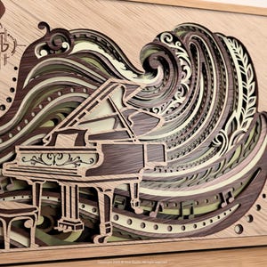 May include: Wooden layered art piece featuring a grand piano and musical notes. The artwork uses various shades of brown, beige, and green to create a wave-like design behind the piano. The piece is framed in a light-colored wooden frame.