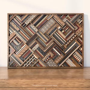 May include: Wooden wall art with a geometric design. The artwork features a variety of patterns and colors, including brown, red, black, and white. The piece is framed in a dark wood and rests on a wooden surface.