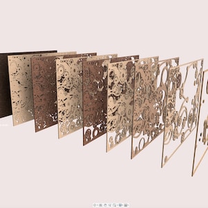 May include: A series of laser-cut wooden panels in varying shades of brown, arranged to show the different colors and designs. The panels feature intricate gear and clockwork patterns, with a light pink background.