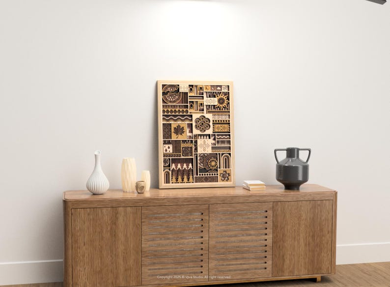 May include: A wooden framed art piece with a geometric design, displayed on a wooden cabinet. The artwork features various shapes and patterns in shades of brown and beige. Decorative vases and a dark gray vase are also on the cabinet.