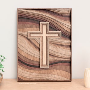 Puede incluir: Arte mural de madera con un dise&ntilde;o de cruz en capas. La cruz est&aacute; centrada sobre un fondo de madera ondulada y en capas en tonos marrones y beige. La obra de arte est&aacute; enmarcada en un borde marr&oacute;n oscuro, creando un efecto tridimensional.