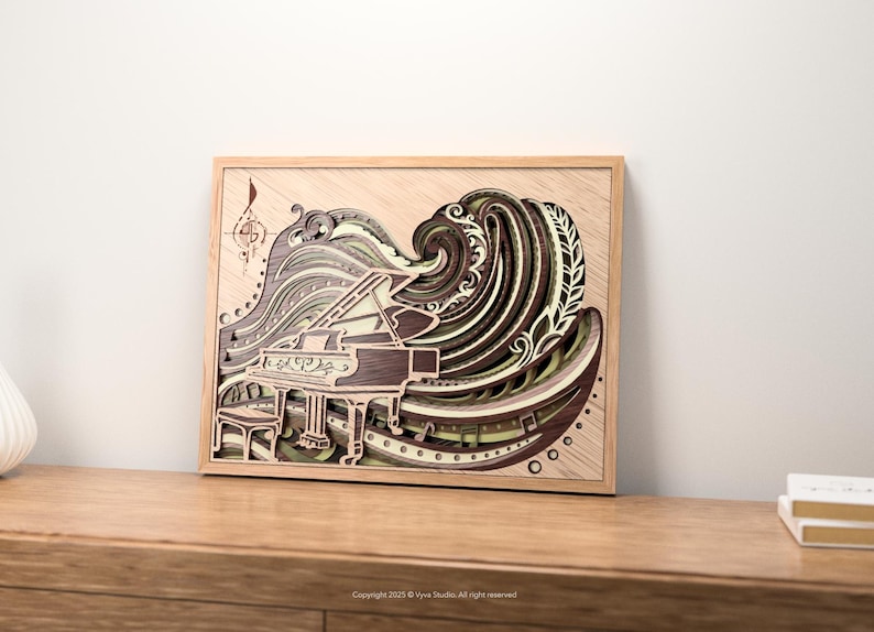 May include: A framed, layered wood art piece depicting a grand piano with a wave-like design. The artwork features shades of brown, green, and tan, with musical notes and a treble clef. The frame is made of light-colored wood.