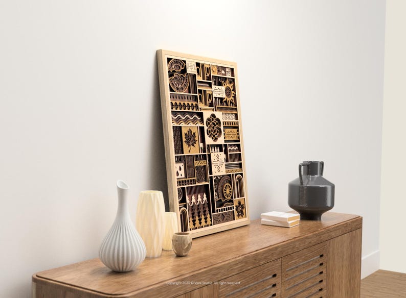 May include: A wooden framed wall art piece with a geometric design, featuring various shapes and patterns in shades of brown and beige. The artwork is displayed on a wooden cabinet, alongside decorative vases and a dark gray ceramic vase.