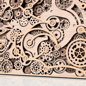May include: A wooden wall art piece featuring a complex arrangement of layered gears and cogs. The design incorporates various sizes and shapes of gears, creating a three-dimensional effect. The artwork is crafted from light-colored wood, showcasing intricate details.